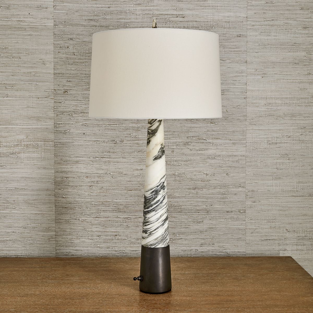 Atelier Table Lamp with tall Arabescato marble base, linen drum shade, and dark bronze dimmer base – refined sculptural lighting by Rachel Blindauer