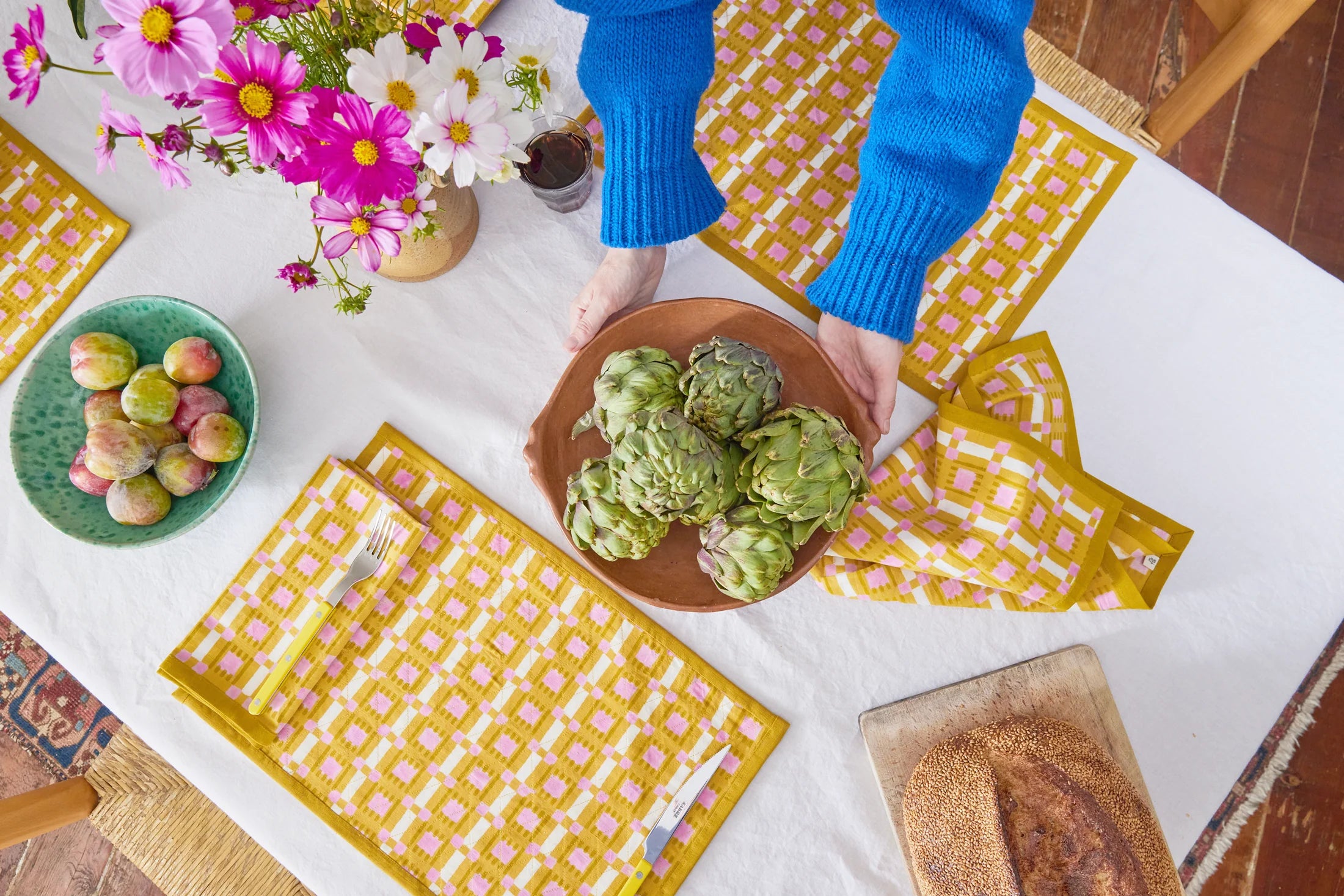 Hand block printed plaid napkin in terracotta, blush, and sand on linen-cotton blend