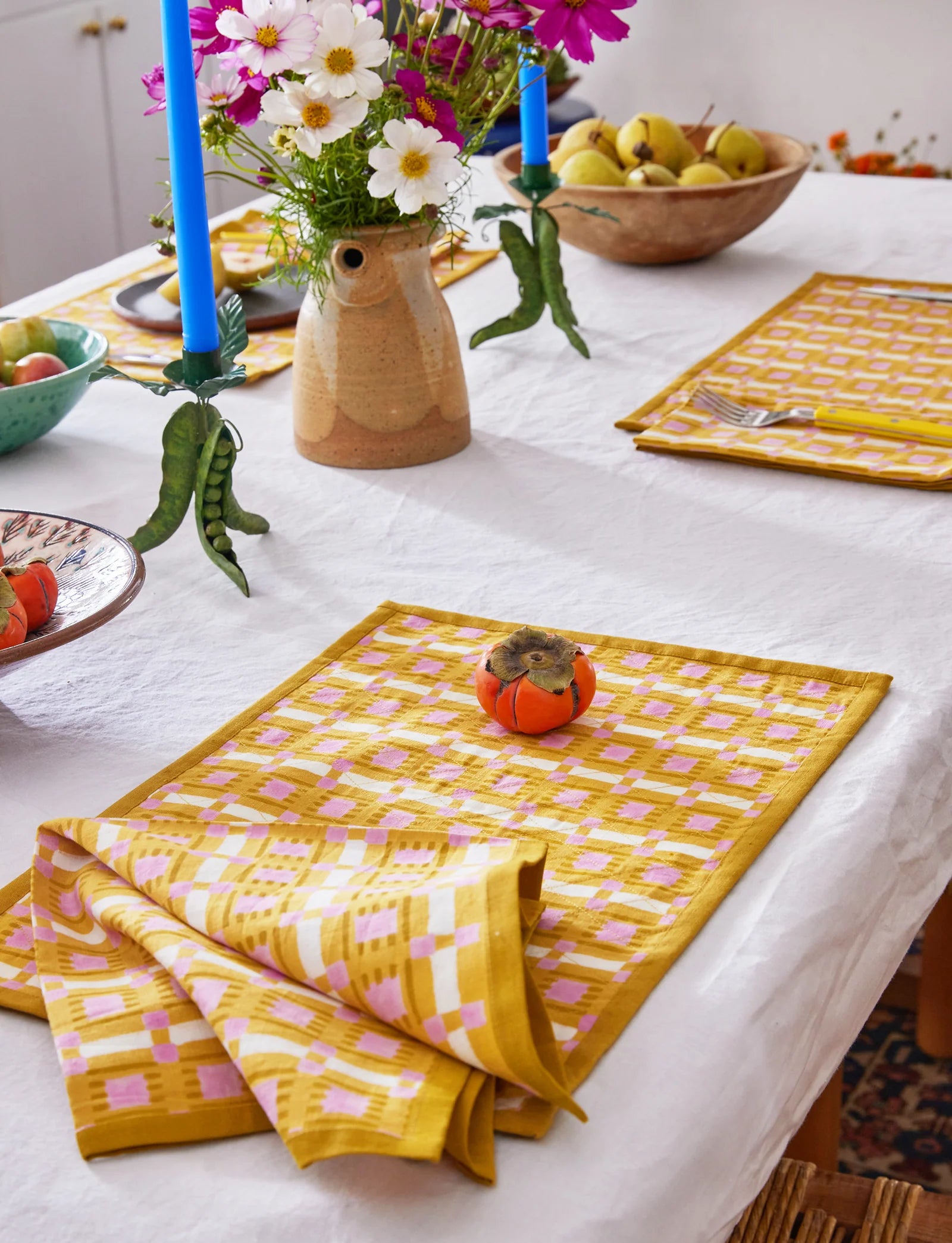 Hand block printed plaid napkin in terracotta, blush, and sand on linen-cotton blend