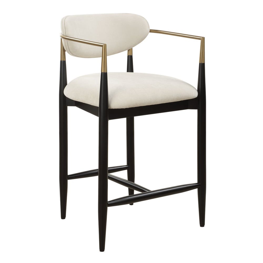 Mid-century modern counter stool with off-white velvet seat, matte black wood base, and brushed brass arms.