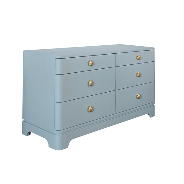 Light blue lacquered six-drawer chest with rounded corners and polished brass beetle knobs, ideal for modern, palm springs or mid-century inspired interiors.