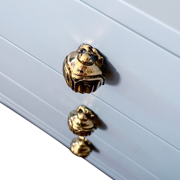 Light blue lacquered six-drawer chest with rounded corners and polished brass beetle knobs, ideal for modern, palm springs or mid-century inspired interiors.