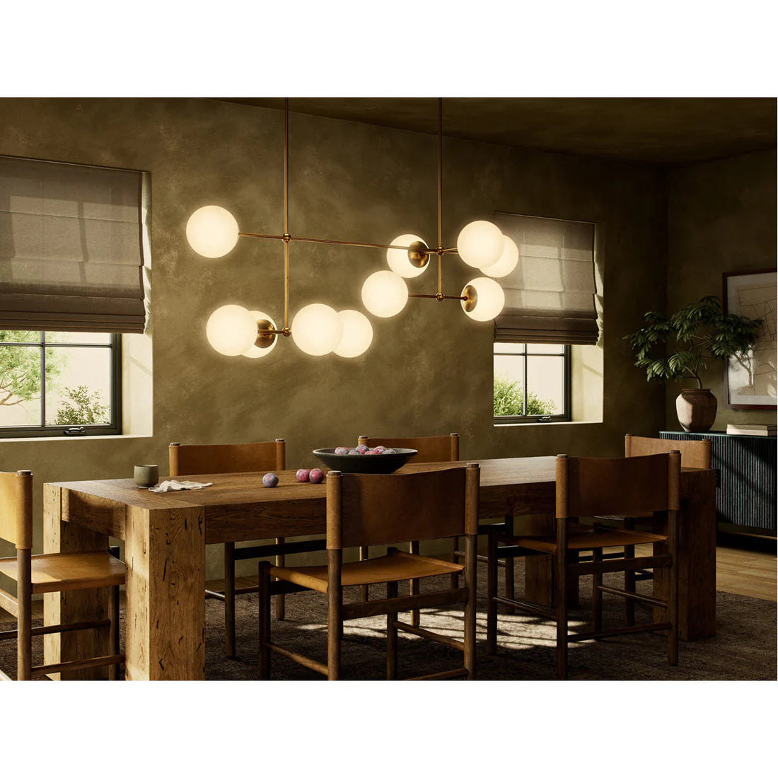 Modern linear chandelier with hand-blown glass globes and sculptural brass rods, ideal for dining rooms, islands, or dramatic entryways.