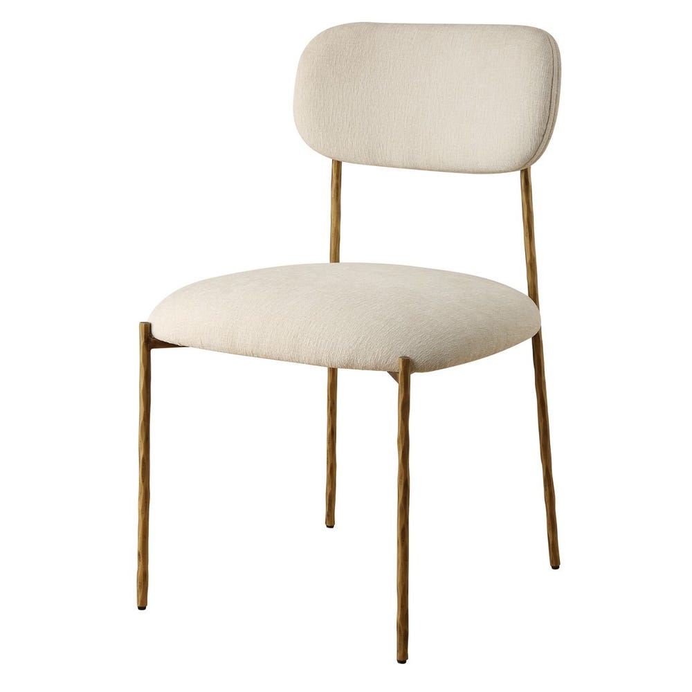Sculptural iron dining chair with antique gold finish and floating off-white upholstered backrest.