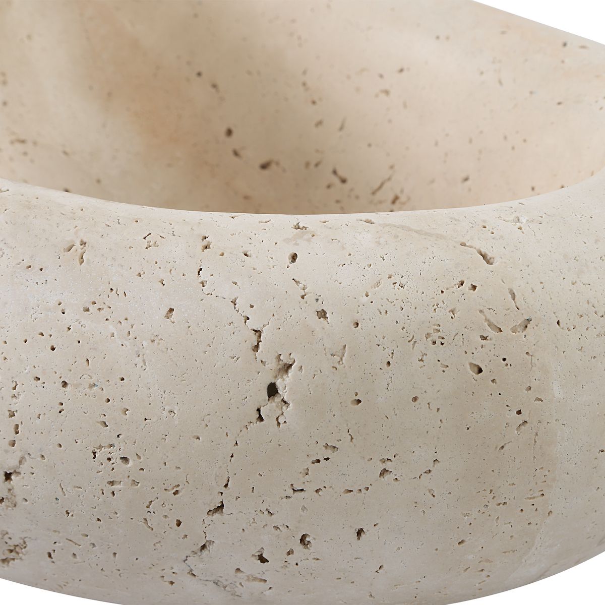 Hand-carved travertine bowls with organic curves and natural veining, designed as sculptural accents for coffee tables, consoles, or bookshelves.