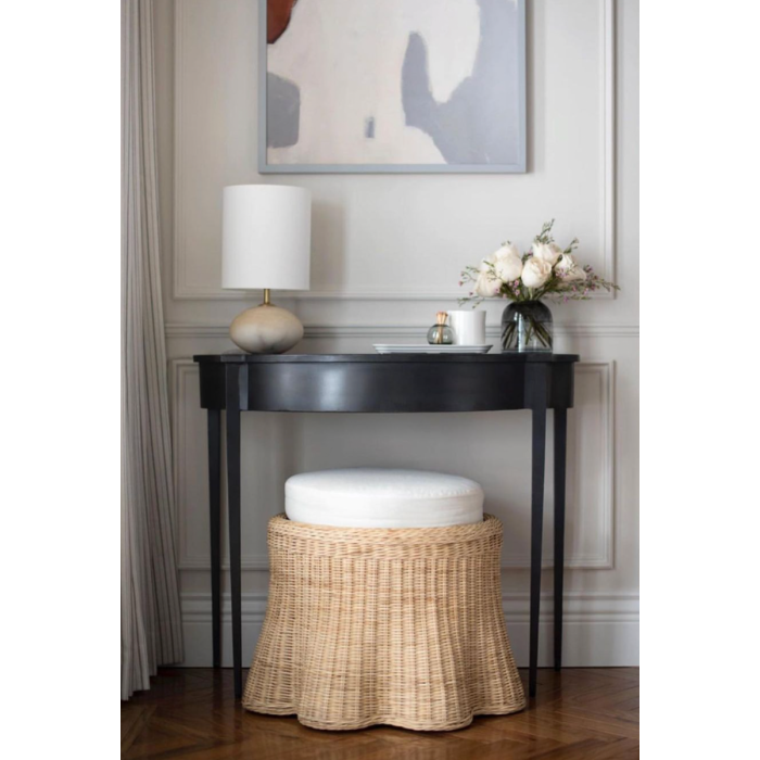 Natural wicker scalloped stool with upholstered cushion, ideal as a vanity seat or accent ottoman.