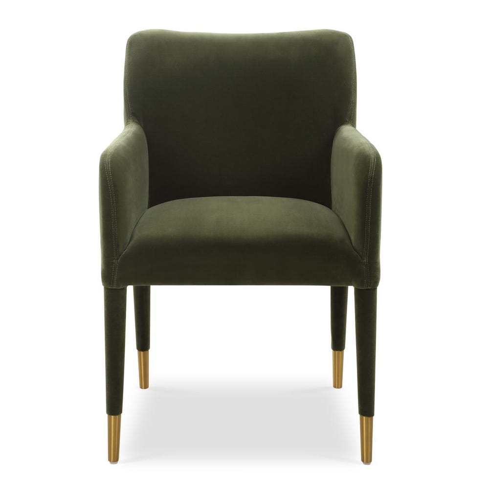 Moss green velvet dining arm chair with tailored silhouette and brushed brass leg caps, styled for modern elegant interiors.