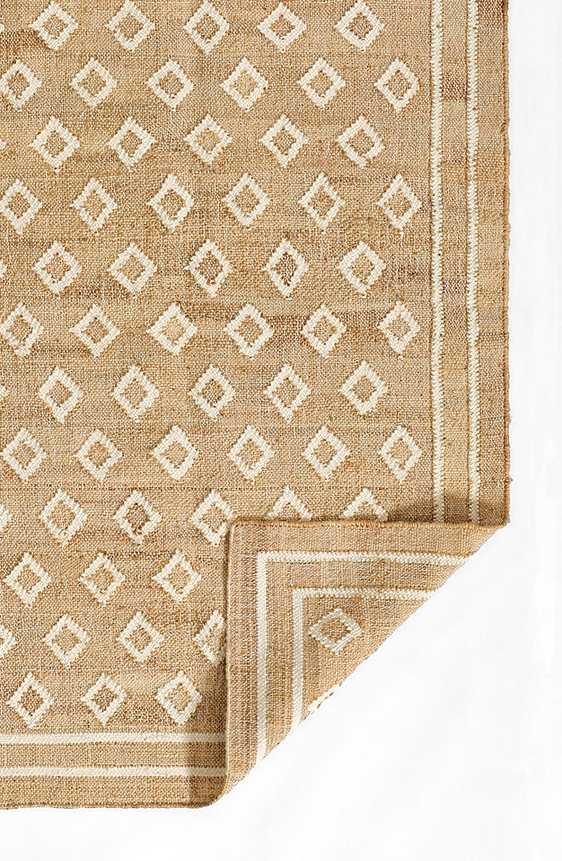 Marigold Handwoven Blockprint Flatweave Rug — corner fold detail revealing natural backing and flatweave construction, one of Rachel Blindauer's favorites