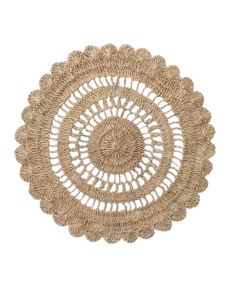 Natural handwoven abaca placemat with scalloped edge, adding organic texture and relaxed elegance to coastal or holiday tablescapes.