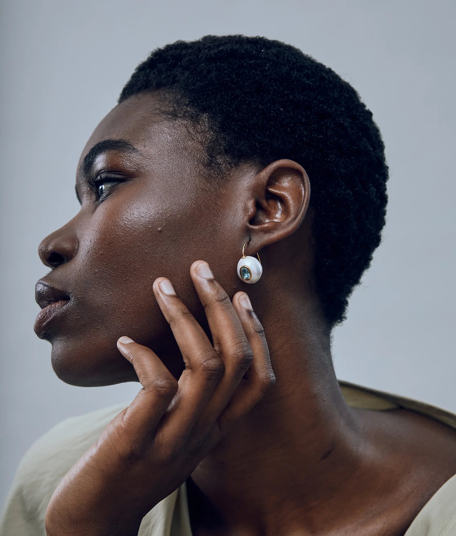 Gold-plated drop earrings with baroque freshwater pearls and faceted blue topaz accents