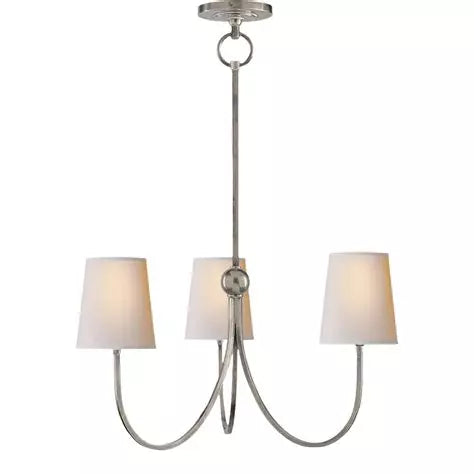 Small brass or nickel chandelier with linen shades and faceted arms, designed for entryways, dining rooms, or layered lighting.