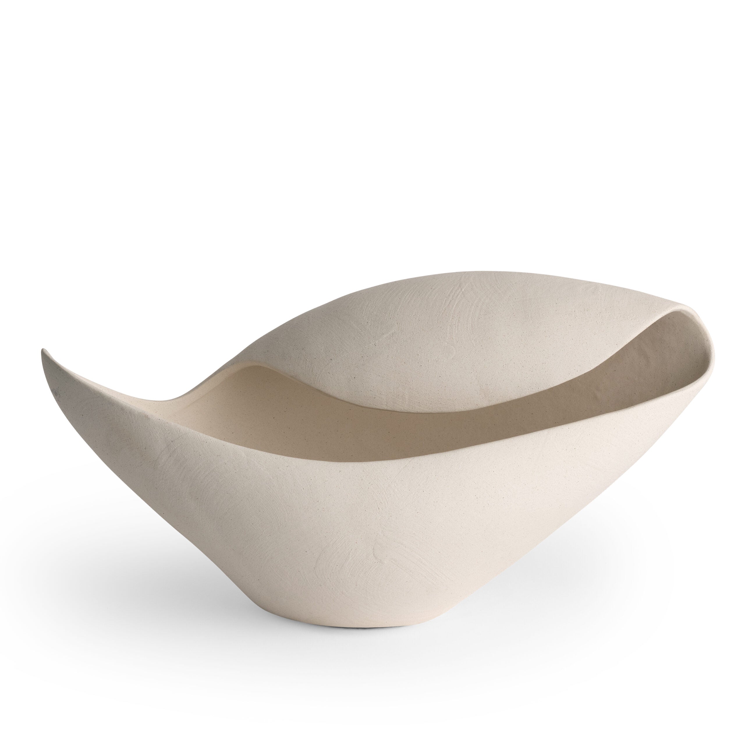 Asymmetric off-white ceramic bowl with sculptural curves, styled as a decorative centerpiece
