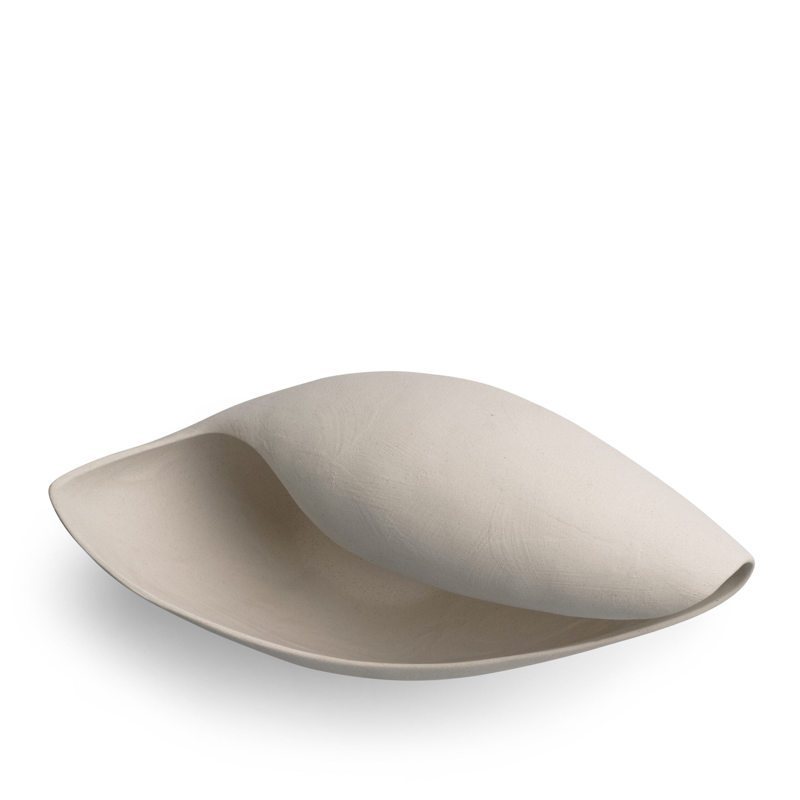 Asymmetric off-white ceramic bowl with sculptural curves, styled as a decorative centerpiece