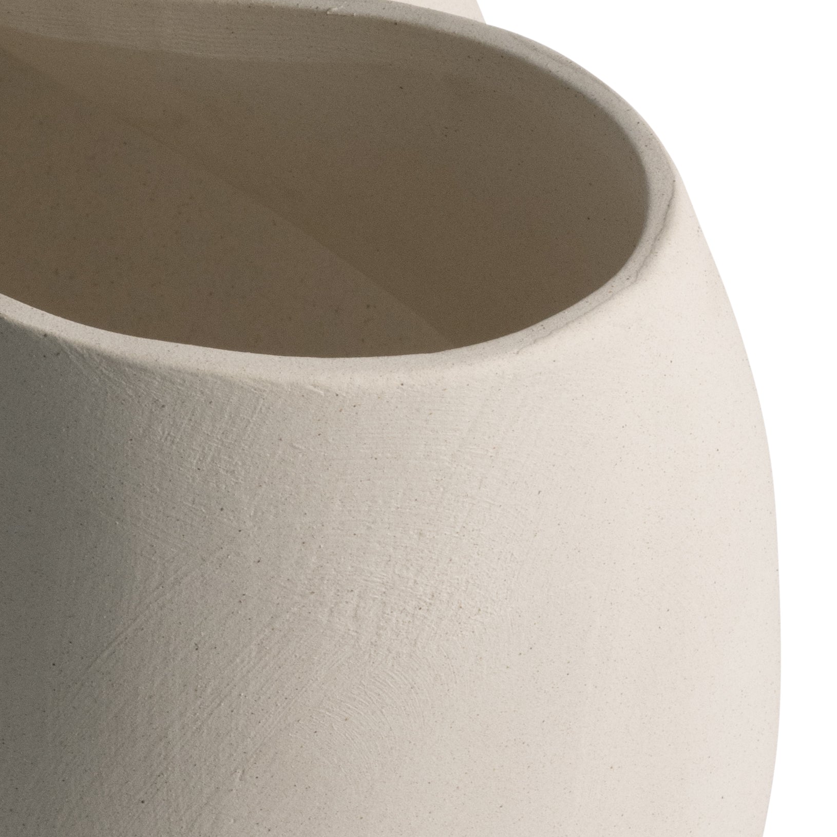 Off-white ceramic vase with an abstract sculptural silhouette, styled as a modern statement piece