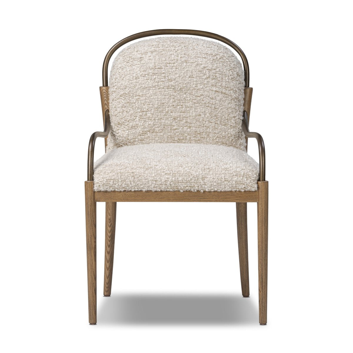Curved upholstered dining chair in stone-toned performance fabric with amber ash wood legs