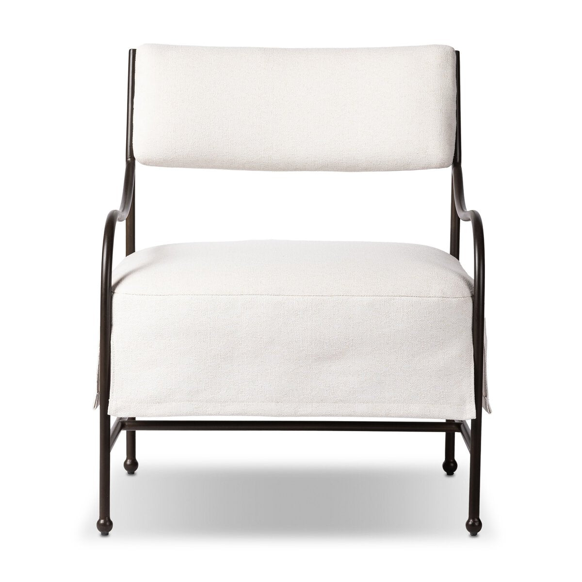 Outdoor lounge chair with curved matte gunmetal frame and handwoven linen-toned seat, styled for sculptural coastal living.