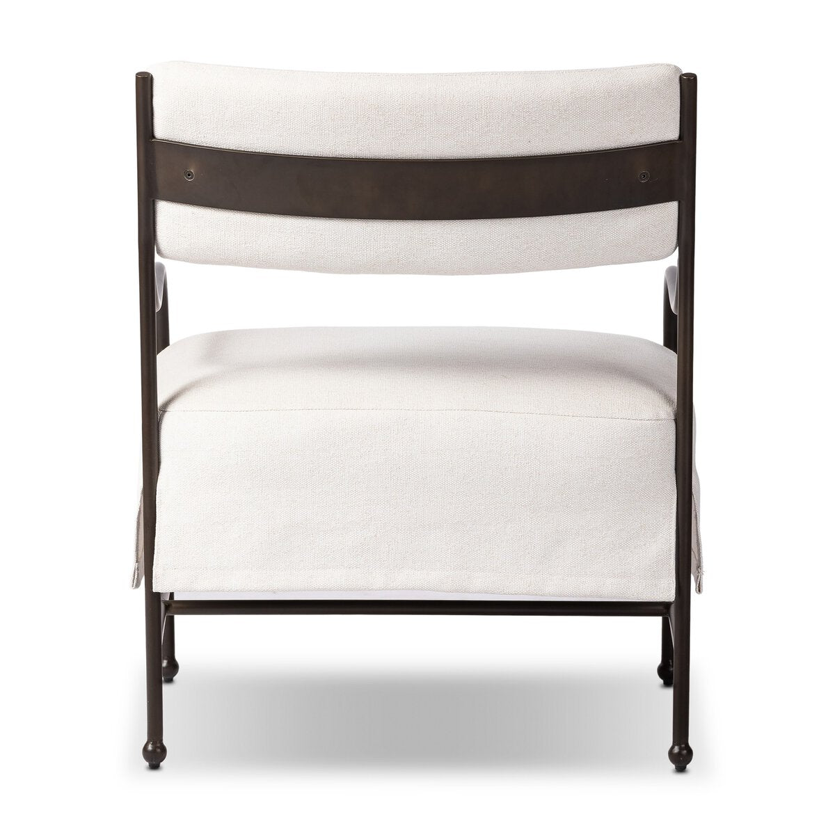 Outdoor lounge chair with curved matte gunmetal frame and handwoven linen-toned seat, styled for sculptural coastal living.
