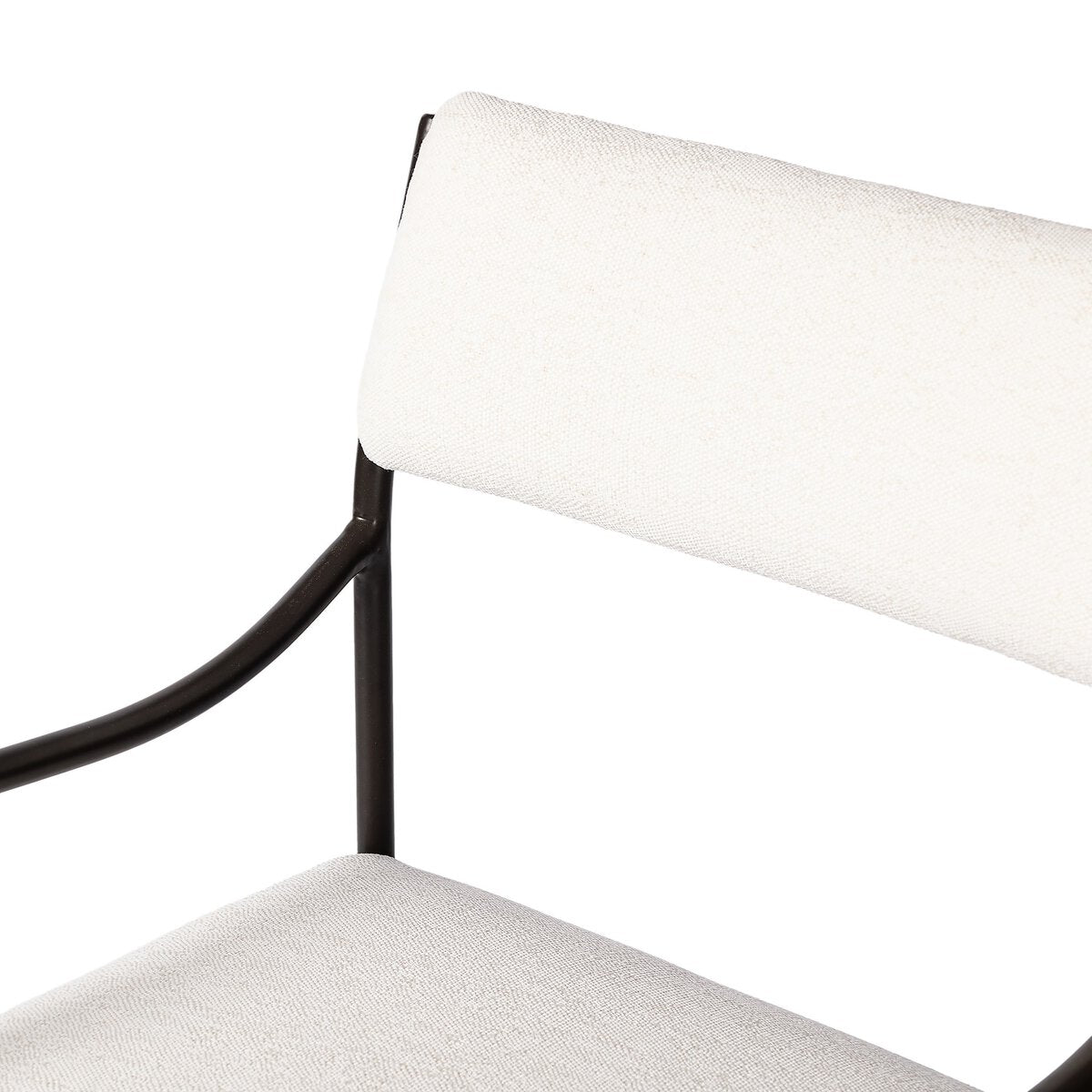Sculptural outdoor dining chair with curved matte gunmetal frame and linen-toned all-weather weave, styled for refined alfresco dining.