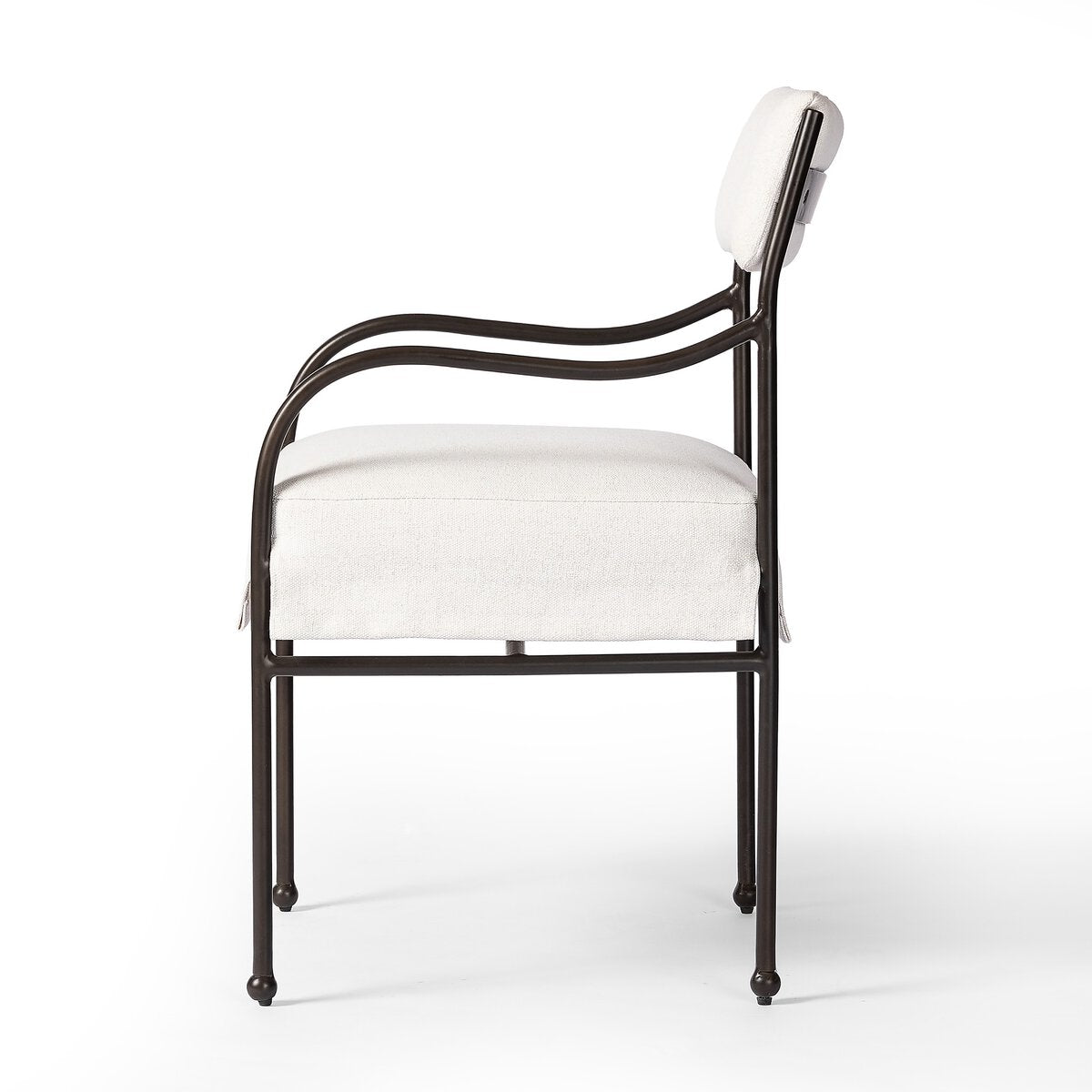 Sculptural outdoor dining chair with curved matte gunmetal frame and linen-toned all-weather weave, styled for refined alfresco dining.