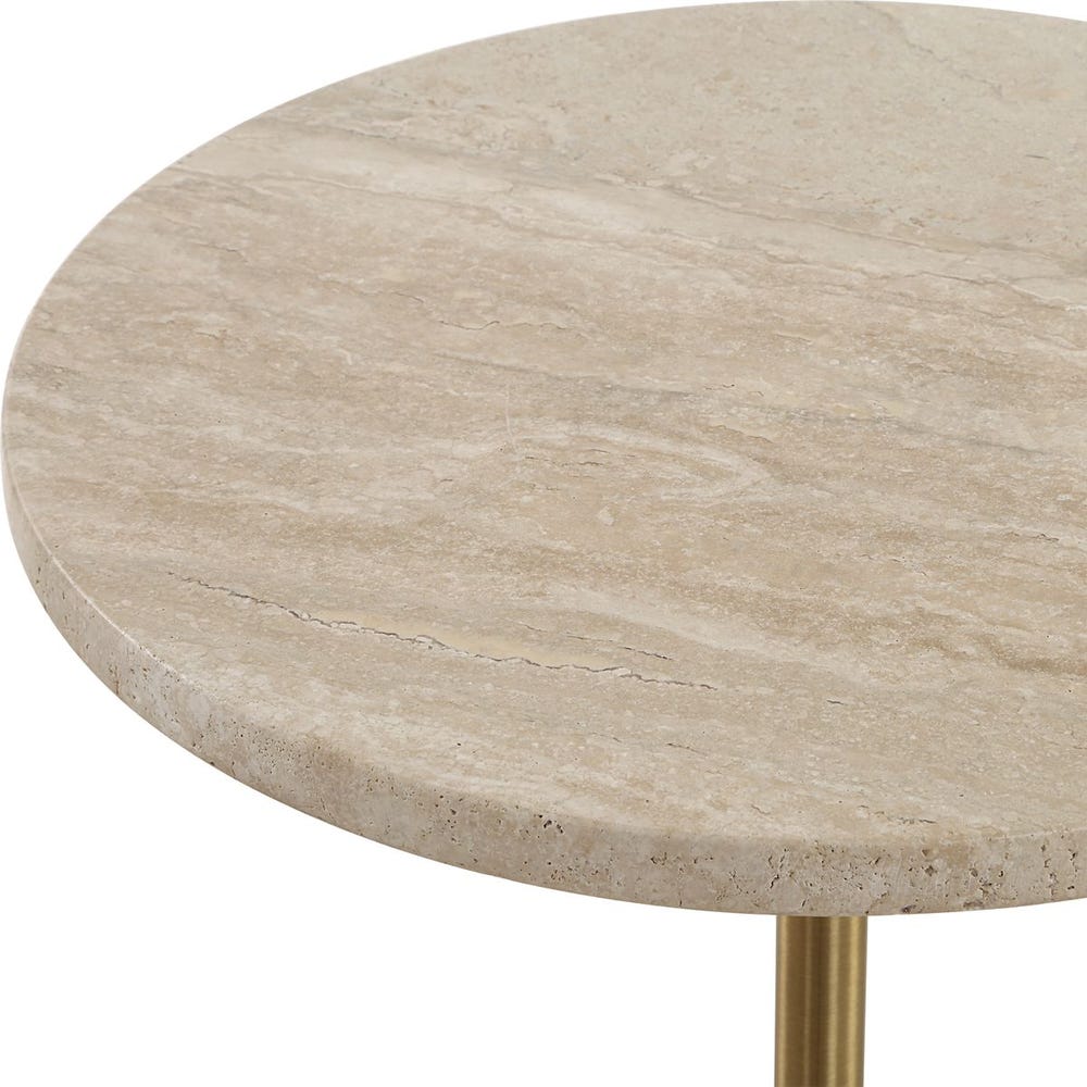Sculptural travertine and brass pedestal table with creamy stone top and slim metal base—ideal as a drink table or side table.