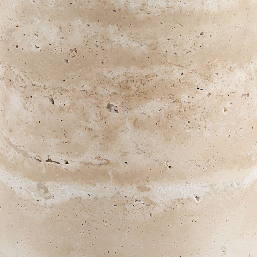 Close-up of beige stone travertine table with natural variations