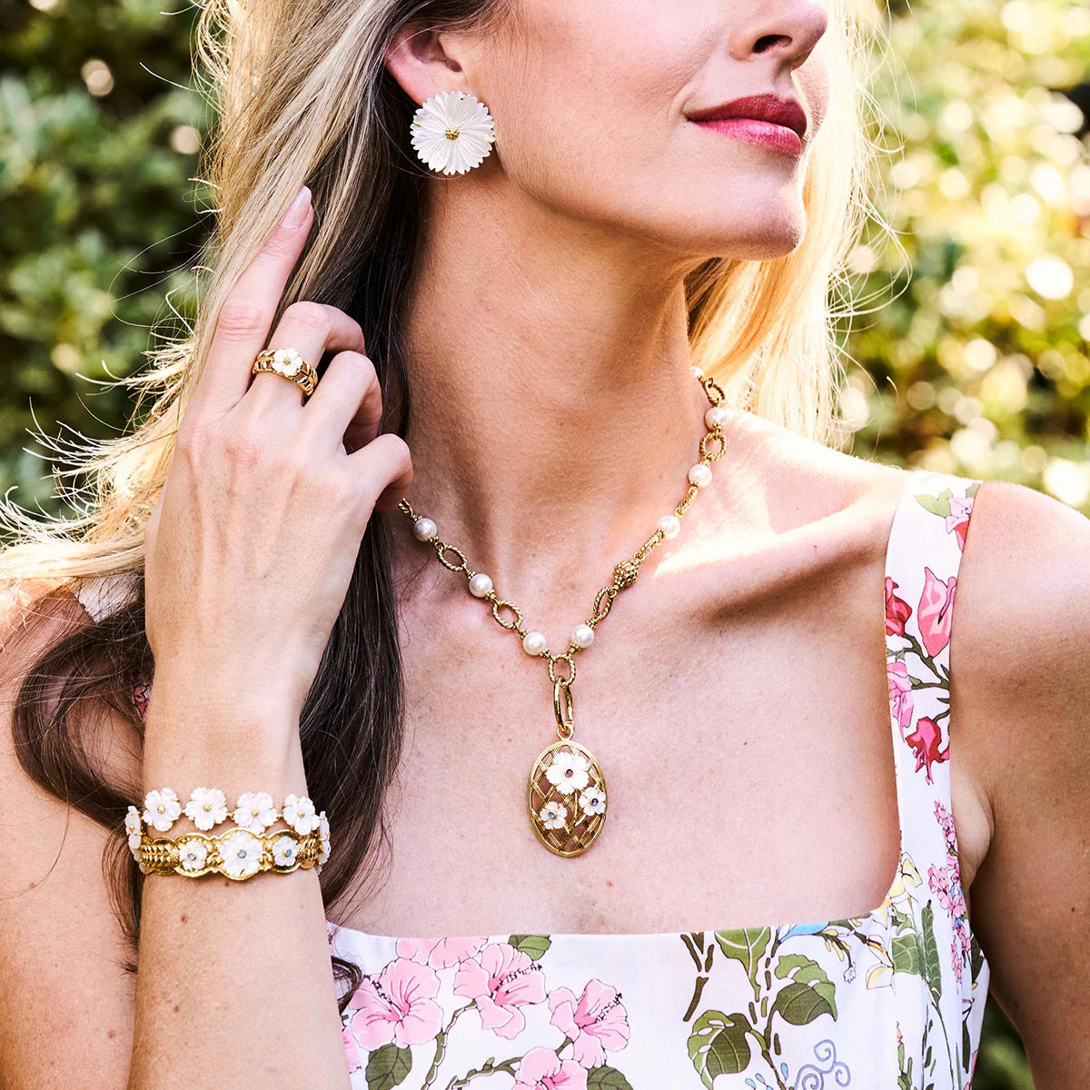 Gold vine ring with mother-of-pearl flower, hand-carved and gold-plated, inspired by spring gardens and timeless romance.