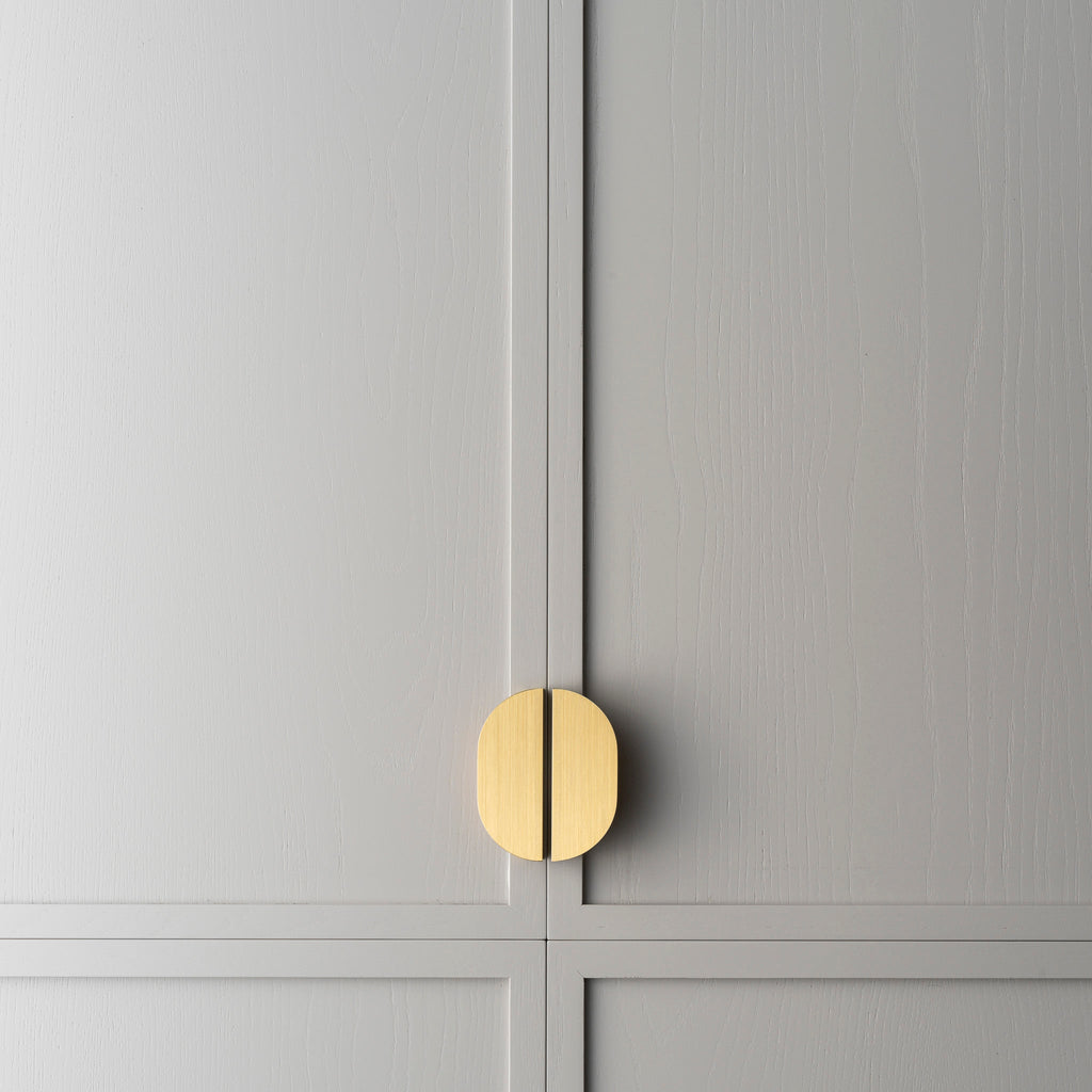 Bow Brass Cabinet Pull installed on kitchen cabinet