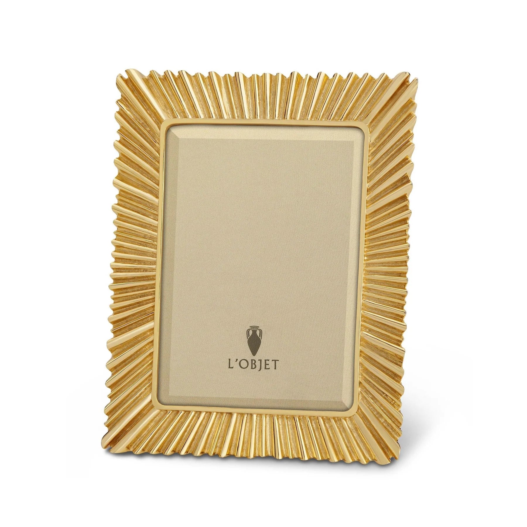 Éclat 24K gold-plated picture frame with beveled glass and suede backing, styled on a console with heirloom elegance.