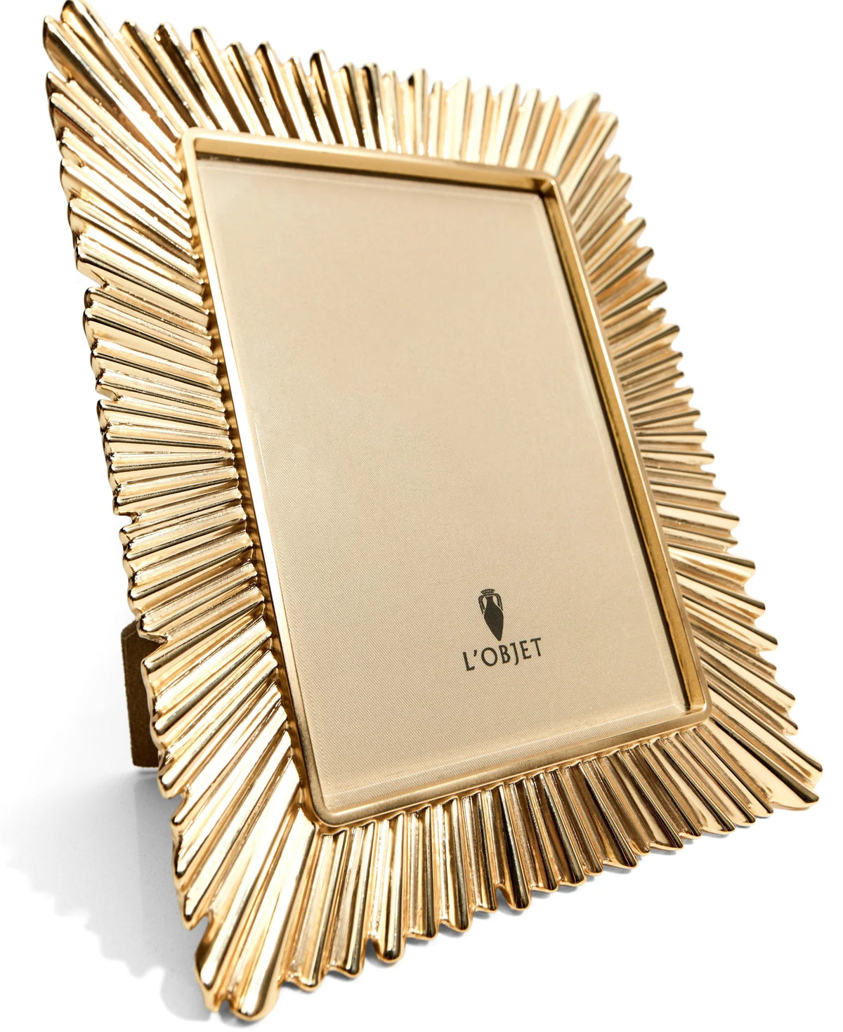 Éclat 24K gold-plated picture frame with beveled glass and suede backing, styled on a console with heirloom elegance.