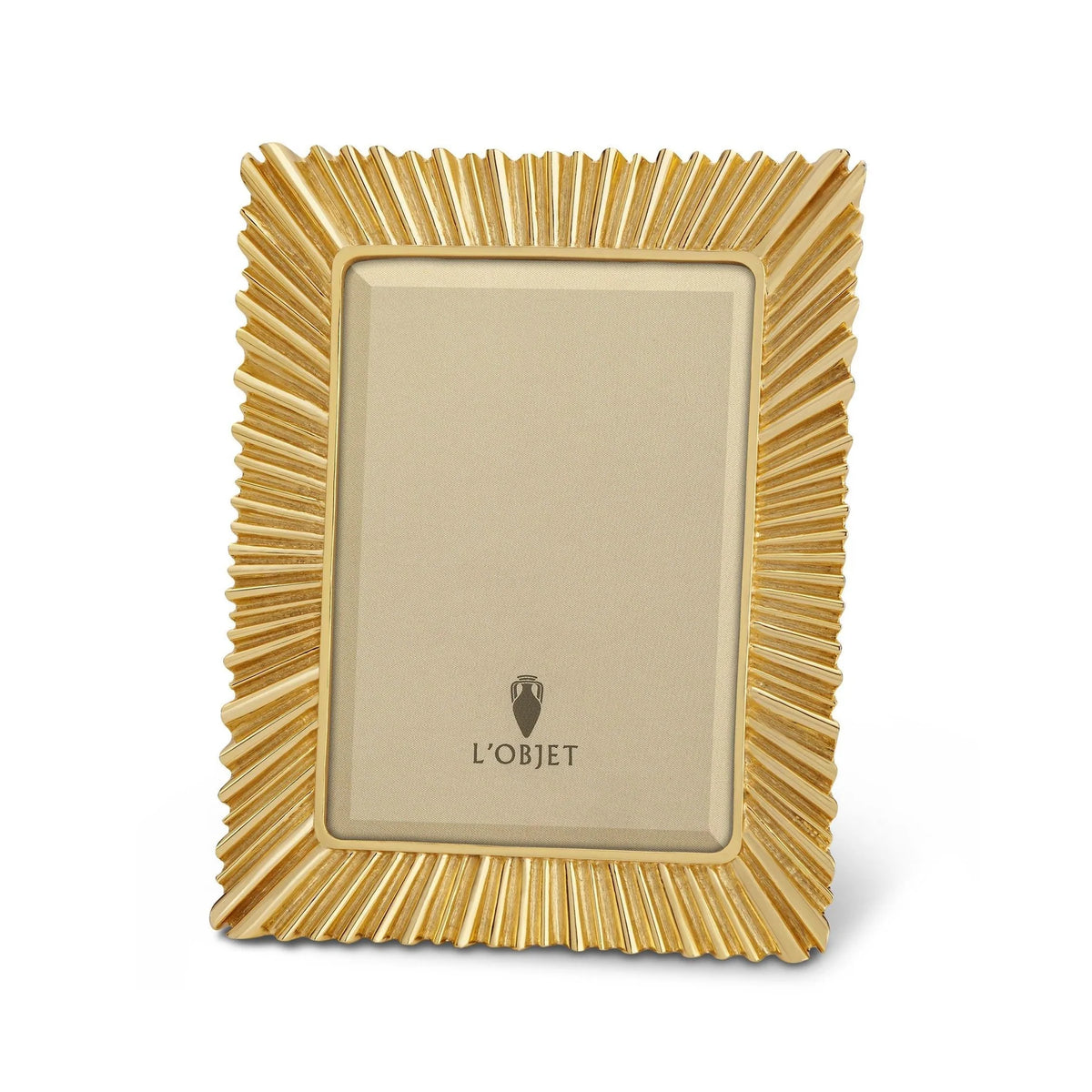 Éclat 24K gold-plated picture frame with beveled glass and suede backing, styled on a console with heirloom elegance.