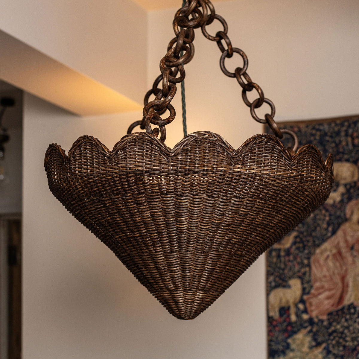 Close-up of the flared teak rattan pendant and chain