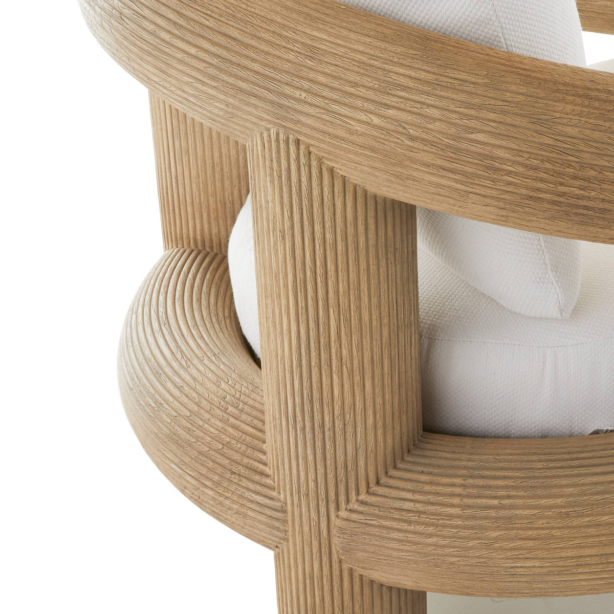 Detail of the reeded teak frame curving around the seat