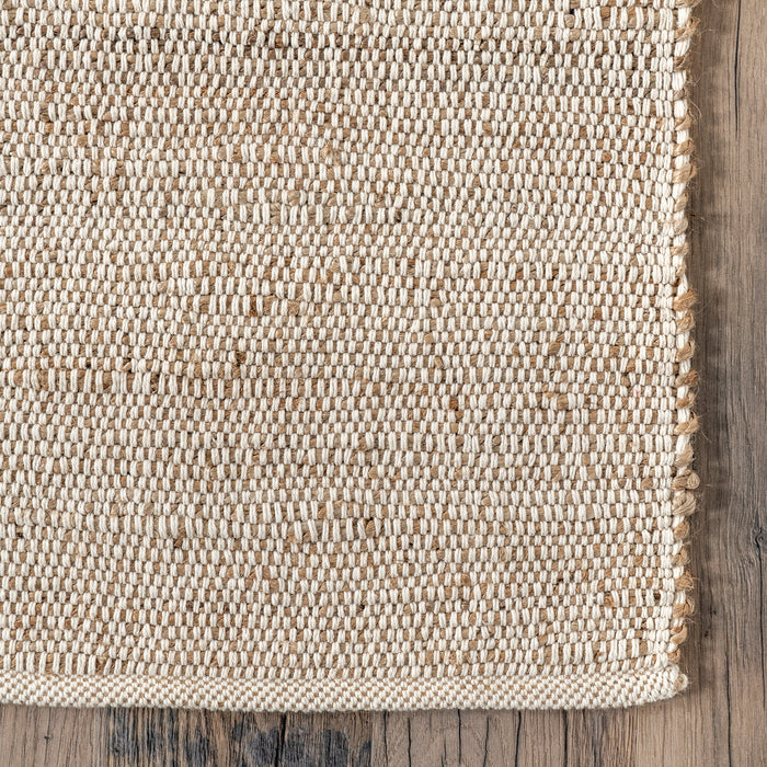 Hawthorne Rug in Natural — woven edge detail