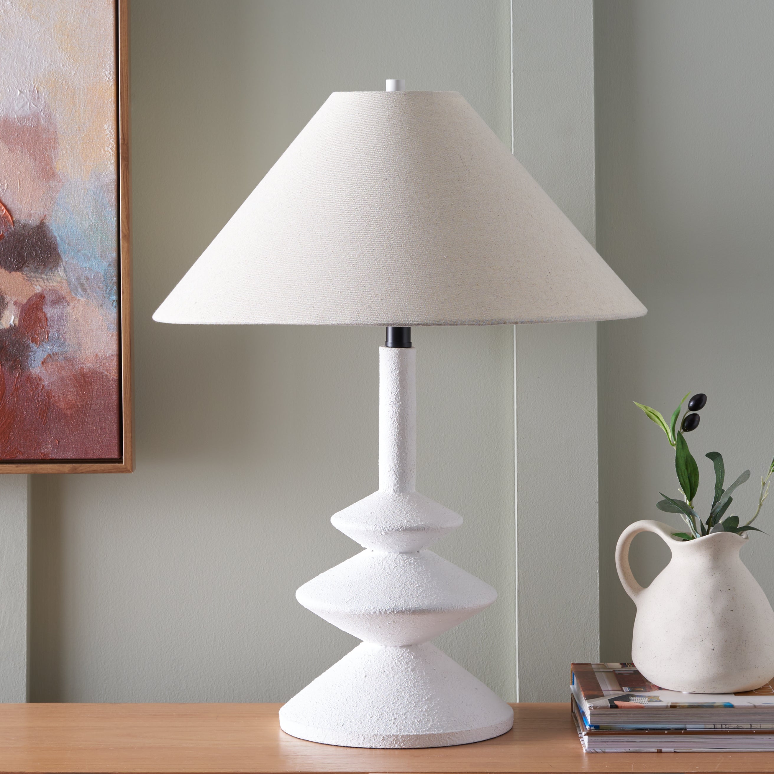 Alcove Table Lamp styled on a nightstand — white sculptural lamp base with soft fabric shade, by Rachel Blindauer