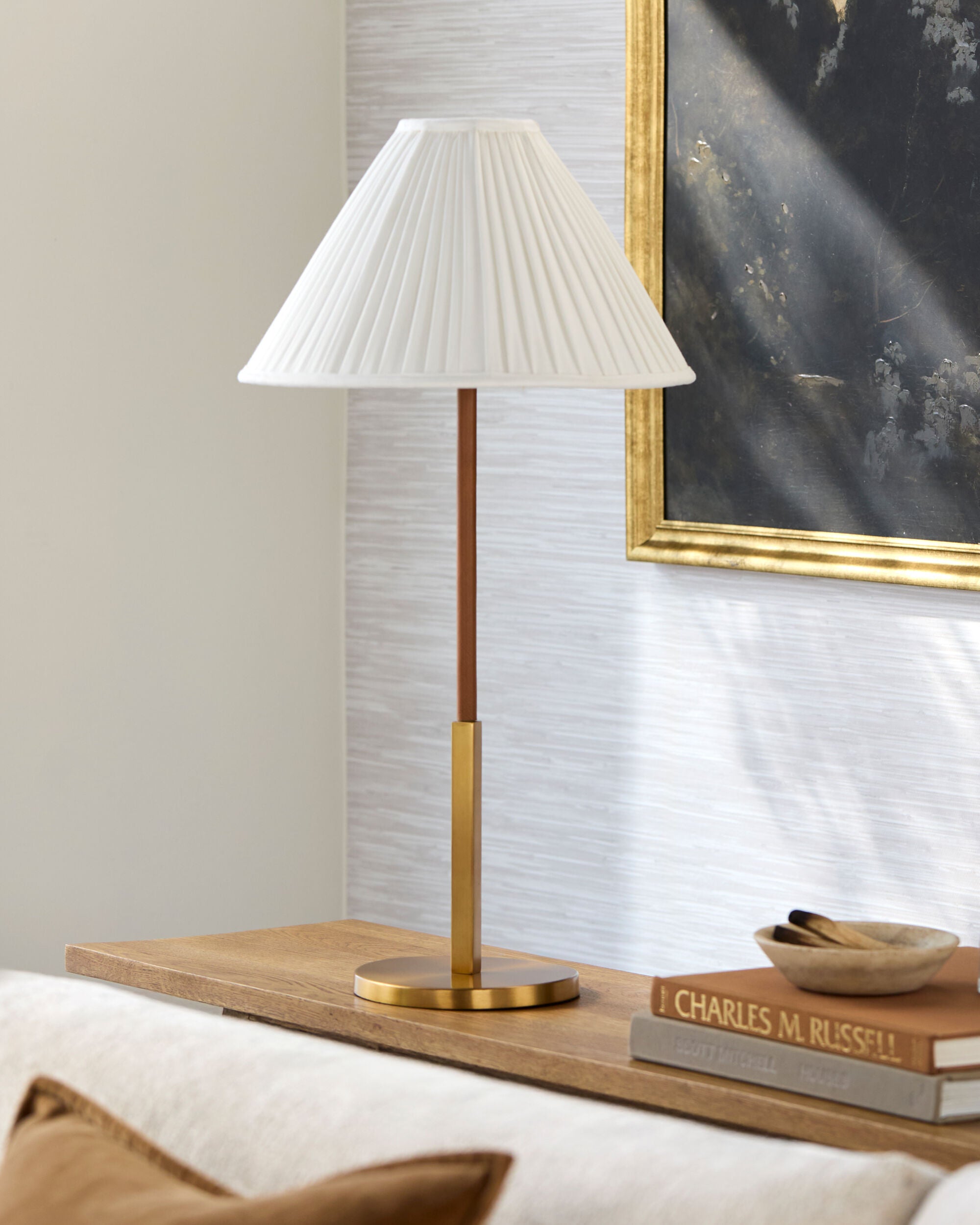 Antiqued gold mid-century table lamp with white cotton shade and slender tapered silhouette