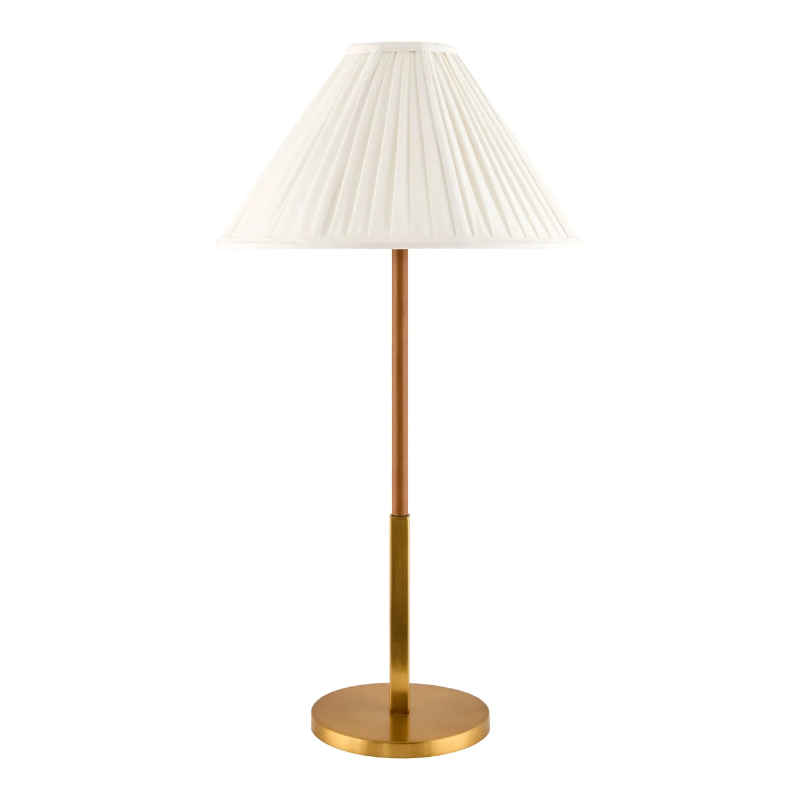 Aurelia Table Lamp — slender brass stem with round base and pleated white linen shade, one of Rachel Blindauer's favorites