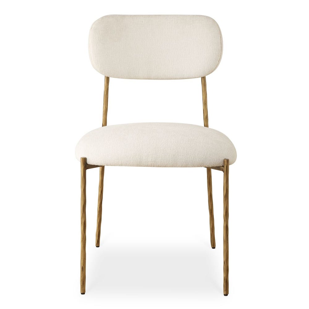 Sculptural iron dining chair with antique gold finish and floating off-white upholstered backrest.