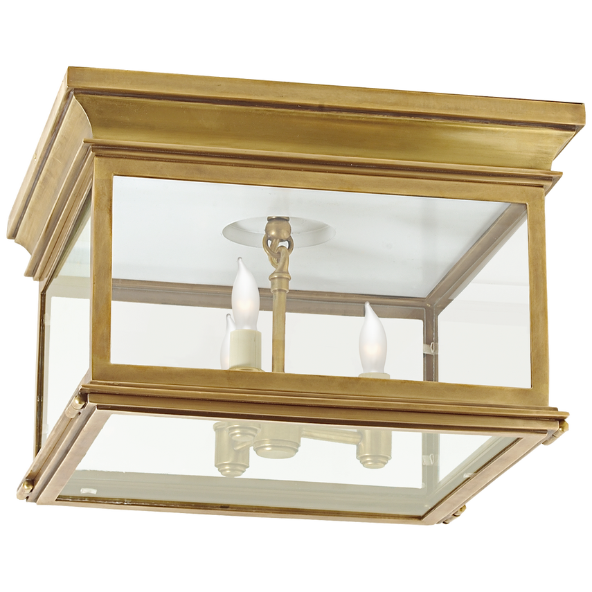 Square flush mount ceiling light with clear glass and antique brass finish for timeless modern interiors.
