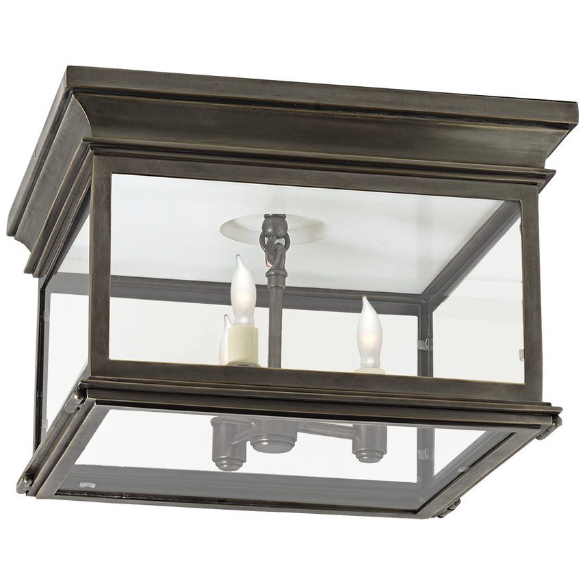Square flush mount ceiling light with clear glass and antique brass finish for timeless modern interiors.
