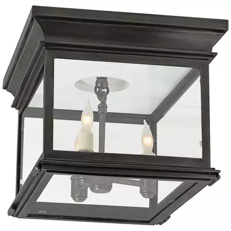 Hudson Small Square Flush Mount light with Bronze frame and clear glass panels, shown ceiling-mounted in a hallway.
