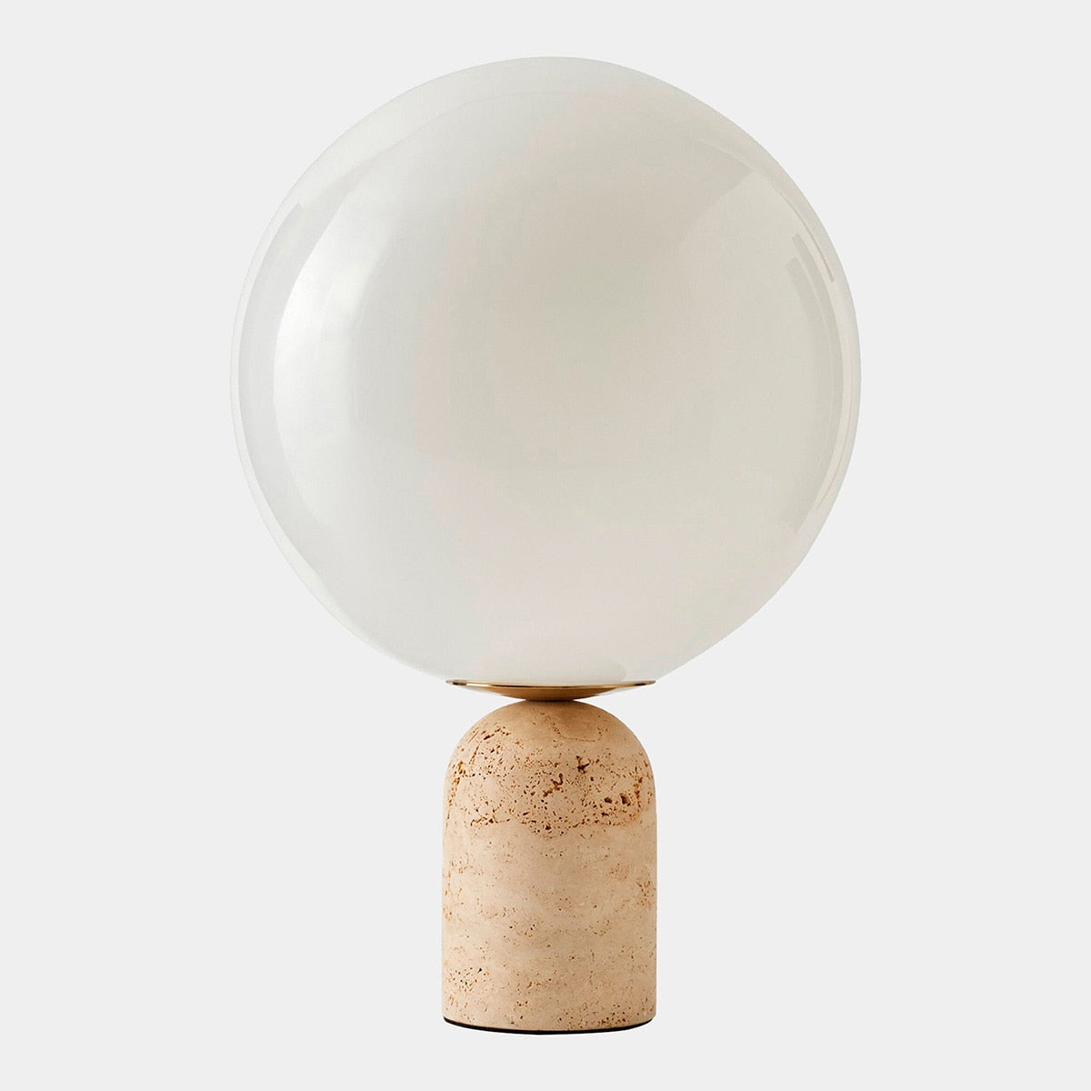 Luna Travertine Table Lamp — frosted glass globe on natural travertine base with brass accents, by Rachel Blindauer