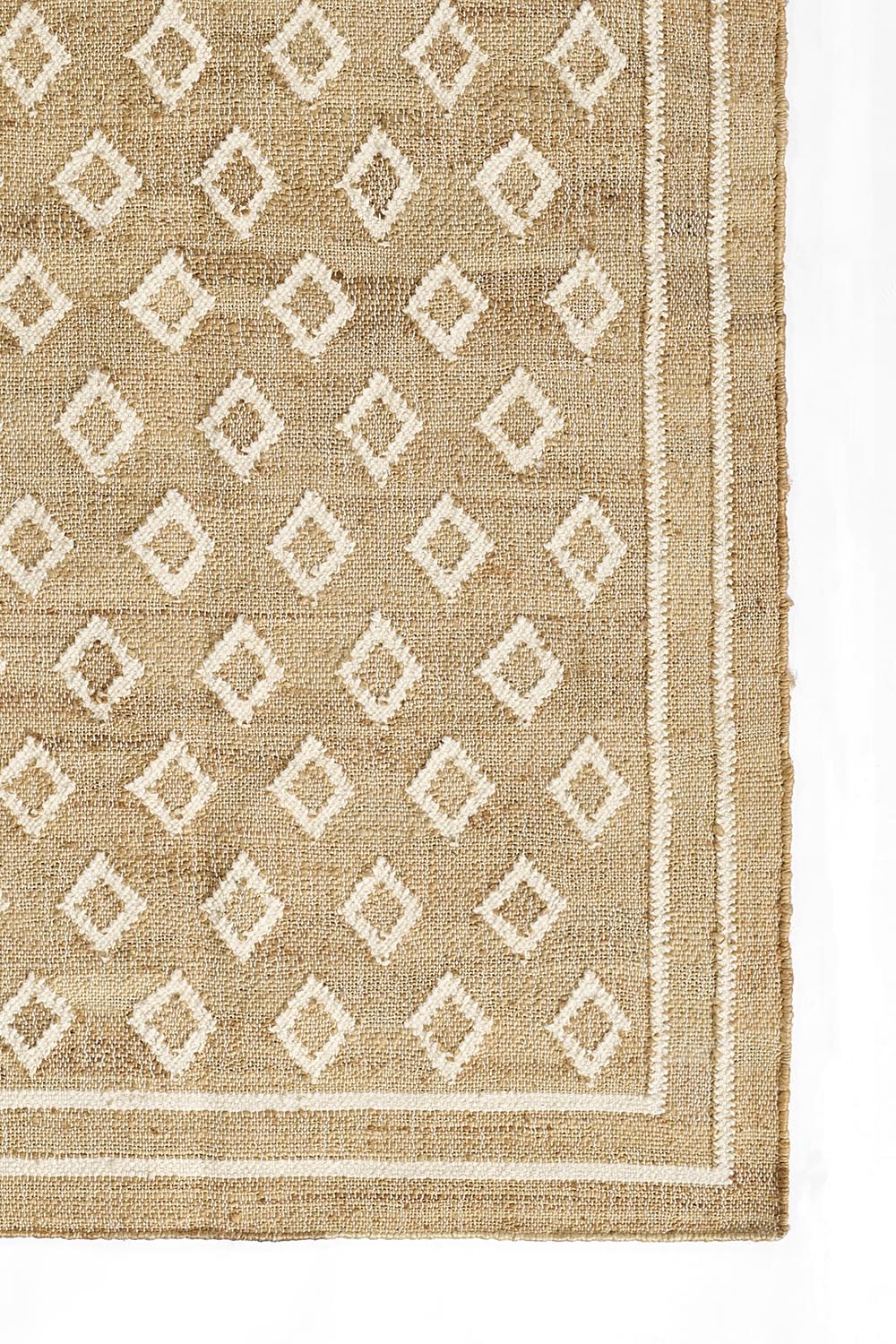 Marigold Handwoven Blockprint Flatweave Rug — close-up detail of diamond blockprint pattern and woven border corner, one of Rachel Blindauer's favorites