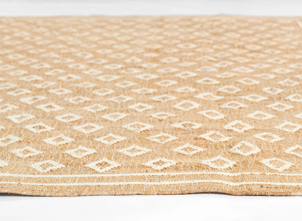 Marigold Handwoven Blockprint Flatweave Rug — low-angle side profile showing flat pile surface and woven edge border, one of Rachel Blindauer's favorites