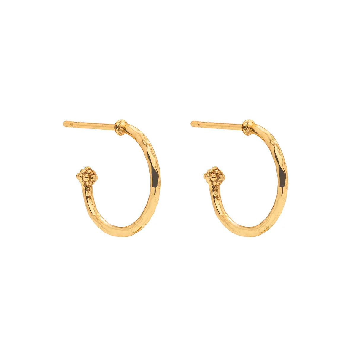 Hand-carved mother-of-pearl flower hoops in 18K gold-plated brass, glowing with movement, elegance, and seaside romance.
