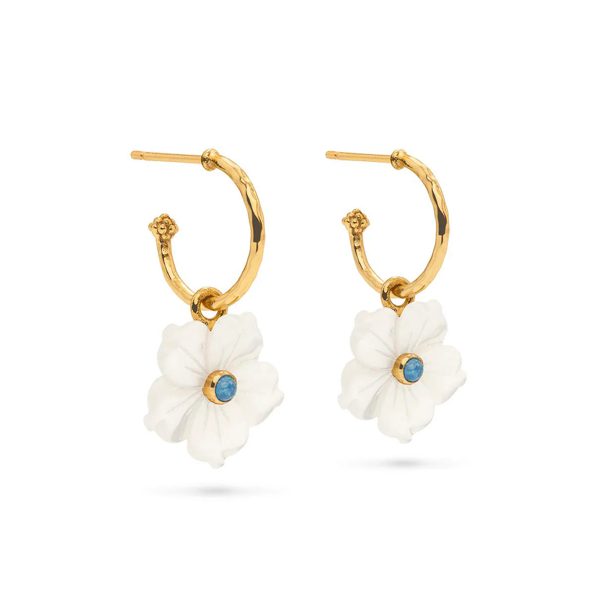 Hand-carved mother-of-pearl flower hoops in 18K gold-plated brass, glowing with movement, elegance, and seaside romance.