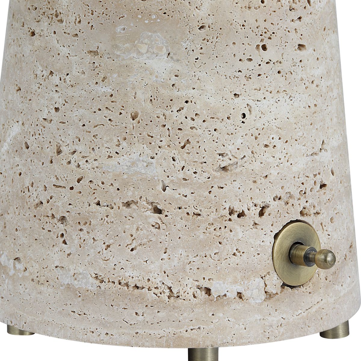 Monolith Table Lamp with honed beige travertine base and antique brass tapered shade, combining sculptural form with ambient lighting