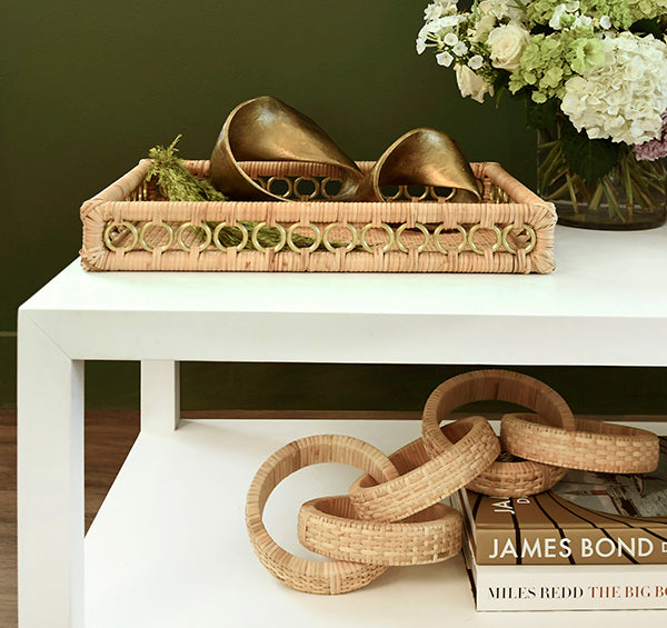 Rectangular rattan catchall tray with brass ring handles—ideal for styling coffee tables, organizing entryways, or serving drinks.