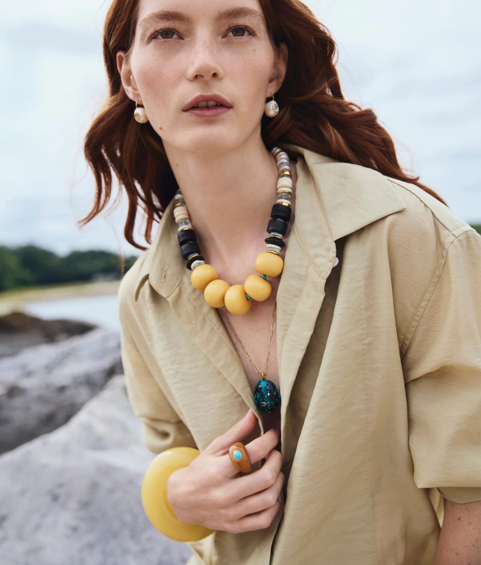 Gold-plated drop earrings with baroque freshwater pearls and faceted blue topaz accents