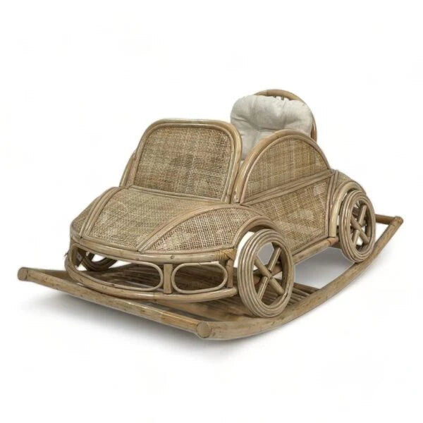 Handwoven rattan rocking car for toddlers with vintage roadster silhouette and natural finish.