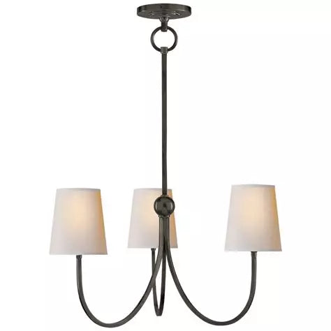 Small brass or nickel chandelier with linen shades and faceted arms, designed for entryways, dining rooms, or layered lighting.